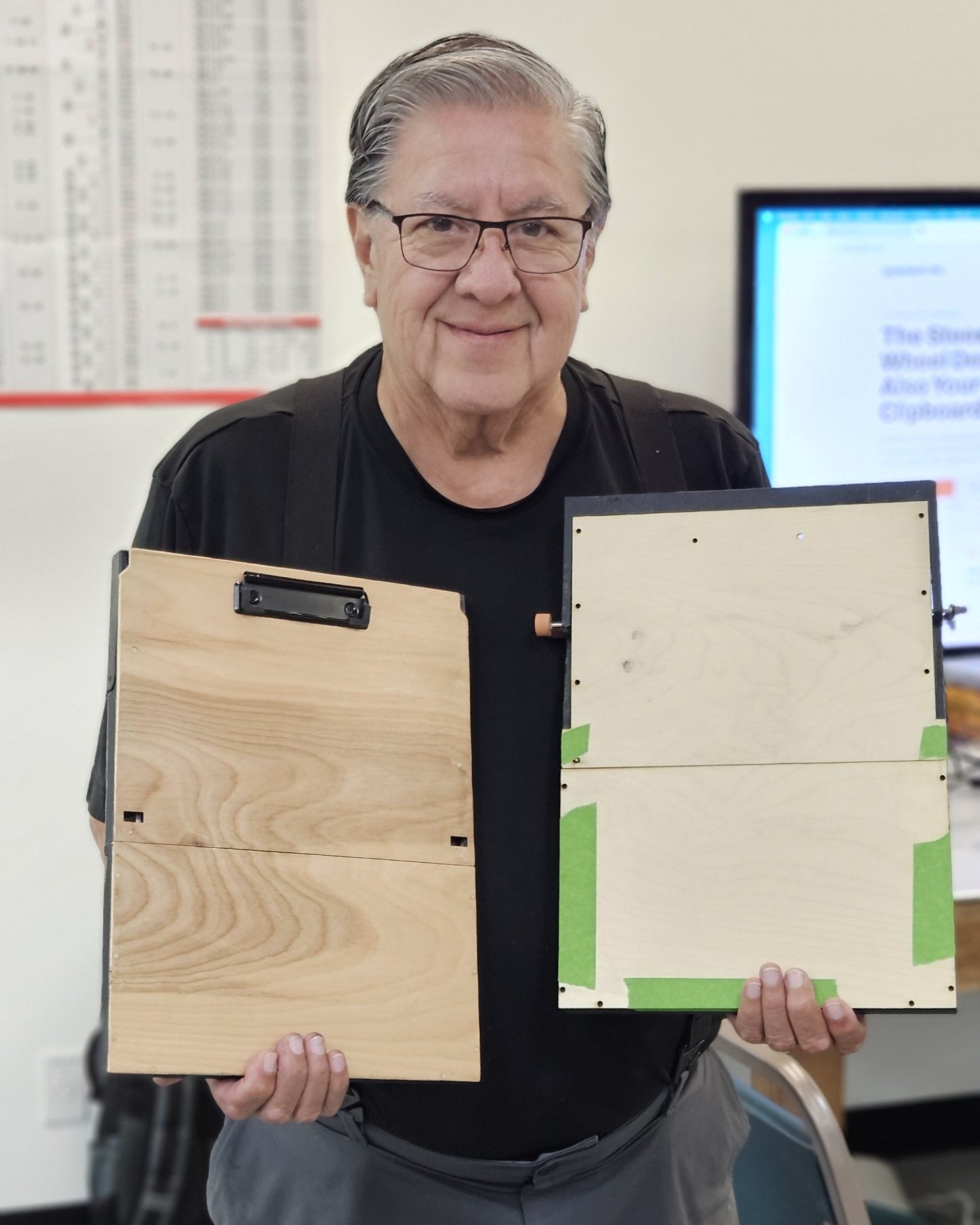 Carlos Ayala, inventor of DeskDrive Pro, holding two DeskDrive Pro prototypes