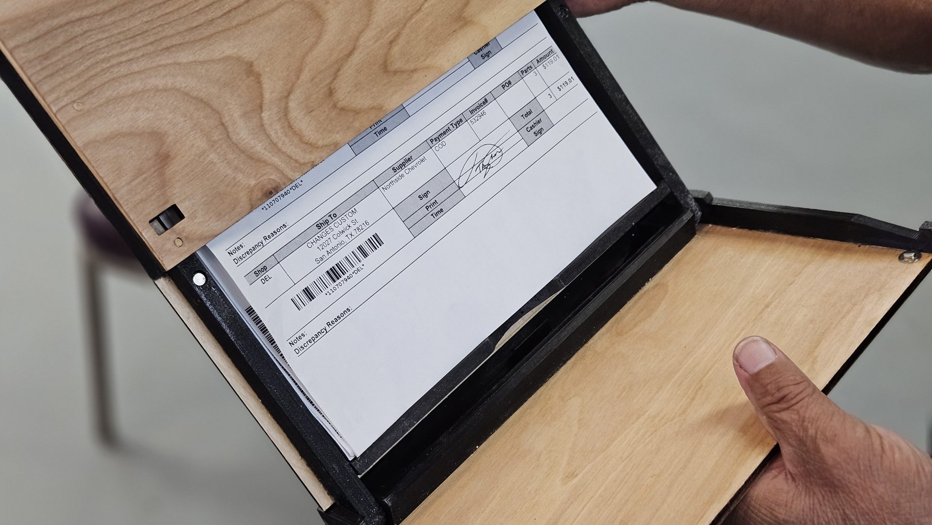 DeskDrive Pro internal storage compartment open, holding paperwork