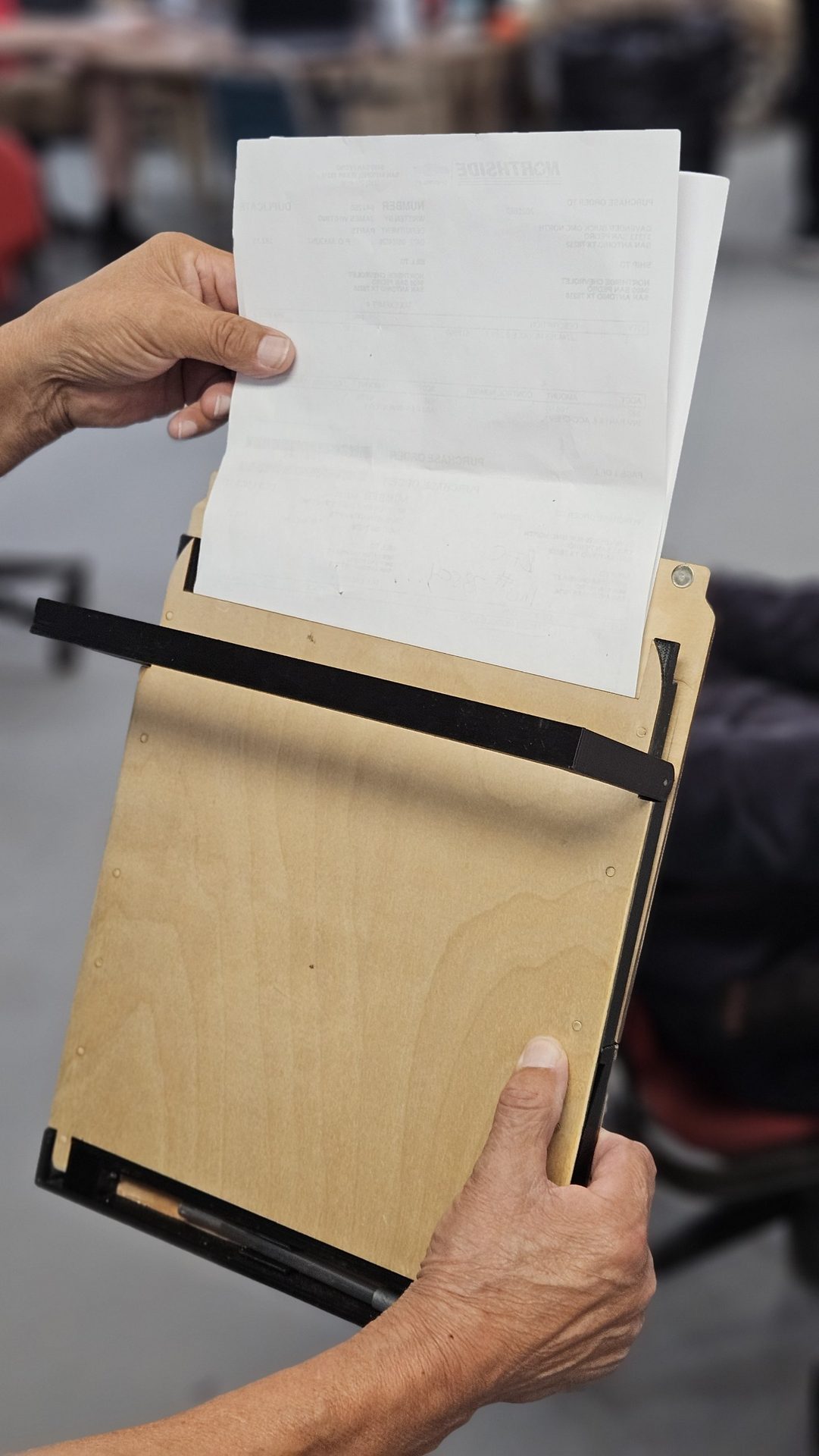 Paperwork sliding into the top slot of the DeskDrive Pro internal storage